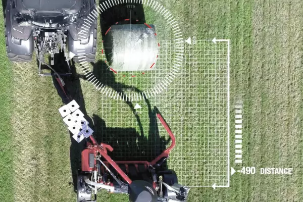 The AUTOLOAD function uses a laser to detect the approaching round bale.